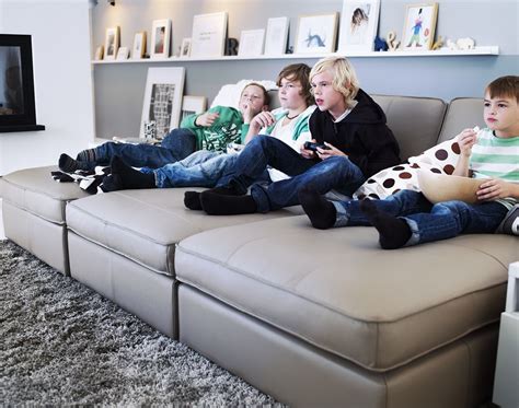 Wherever you go you will find various kinds. IKEA KIVIK chaise longue in leather with children who play ...