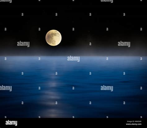 Moon Over The Ocean Stock Photo Alamy
