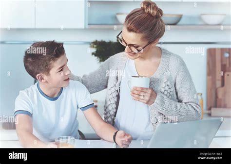 Smart Boy Asking Mom For Help With Home Assignment Stock Photo