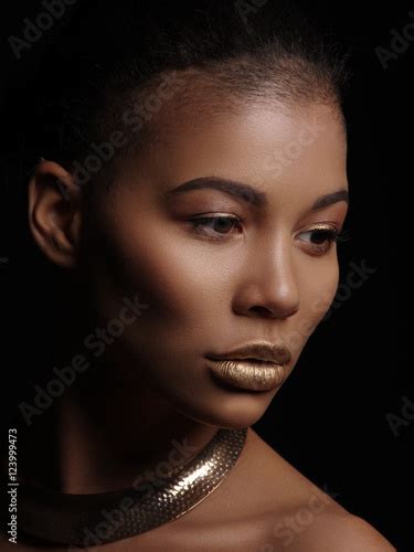 Portrait Of An Extraordinary Beautiful Naked African American Model With Perfect Smooth Glowing