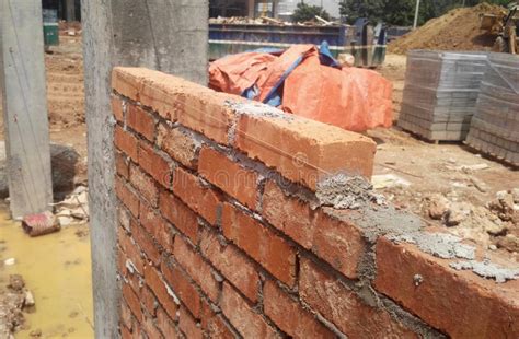 Bricklayer Lay Clay Brick And Stacked It Together Using Cement Mortar