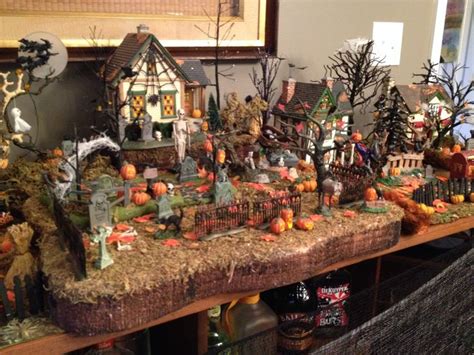 So much decor, so many outdoor halloween decoration ideas! Halloween dept 56 village 2013 | Halloween village display ...