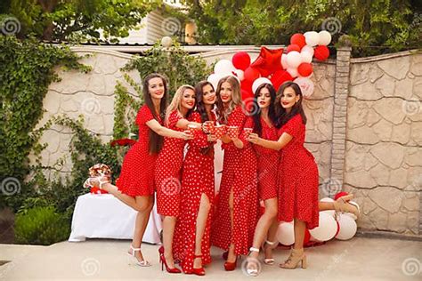 Polka Dot Birthday Party Group Of Female Friends Enjoying And Laughing