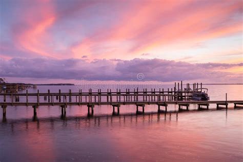 Swirly Pink Sunset Sky Over Dock In Duck Nc Stock Image Image Of