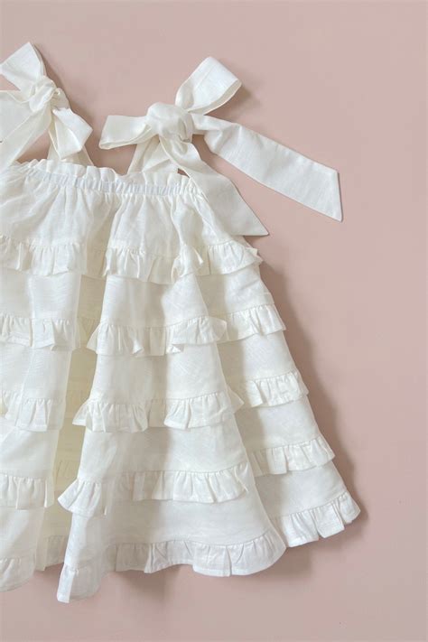 A fabulously feminine flouncy oversized bow dress in a luxe linen blend