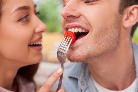 Cheerful Young Loving Couple Is Eating In Stock Image Image Of Eating