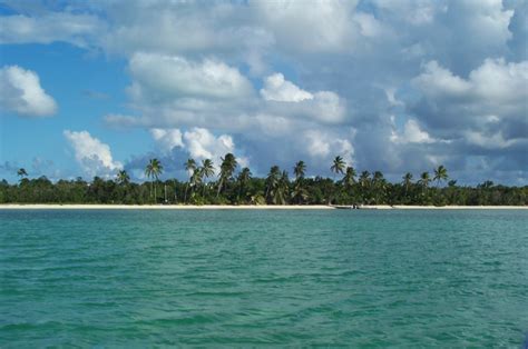 Island definition, a tract of land completely surrounded by water, and not large enough to be called a continent. Andros, Bahamas - Wikipedia