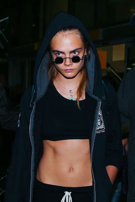 cara delevingne flashes her toned tummy in tiny crop top as she touches down in brazil irish