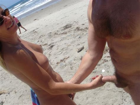 Wife With Round Breasts Stroking Cock At Nude Beach
