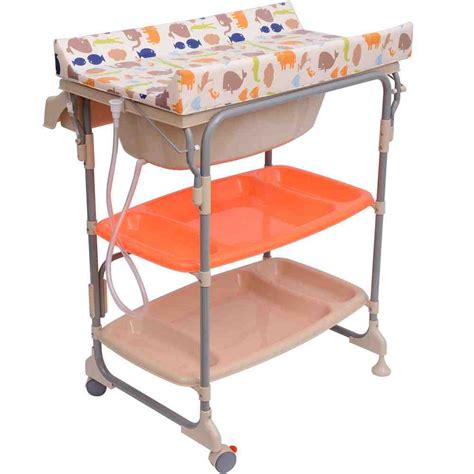 Keep your baby wrapped in the towel, bathing one part at a time. Foldable Changing Table for Baby - HomesFeed