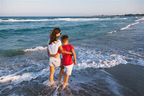 Mom And Son Walking And Playing On The Beach Stock Photo Image Of Relations Sunset