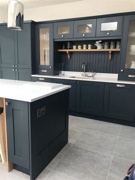Besides, you may consider using different tones of white to achieve a monochrome feel within your cooking space. Navy kitchen with tongue and groove back splash white ...