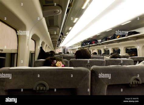 Passengers On A Shinkansen Bullet Train Leaving Tokyo In Japan Stock