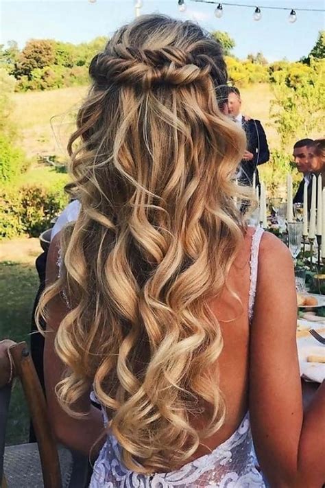 Shape and style the topknot in the front and back using bobby pins. 11 Half Up Half Down Curly Hairstyles to Try Without Any ...