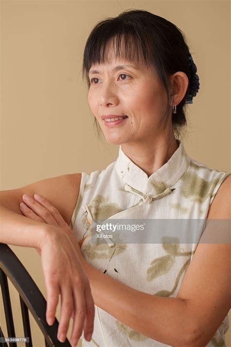 Mature Chinese Woman In Traditional Dress Qipao Stock Photo Getty Images