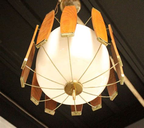 Modern glass light fixtures have long been popular, with older editions for sale from the 18th century and newer versions made as recently as the 21st century. Vintage Teak and Brass Mid Century Danish Modern Light Fixture Chandelier at 1stdibs