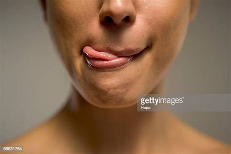 Young Woman Licking Lips Close Up Of Mouth Photos And Premium High Res Pictures Getty Images