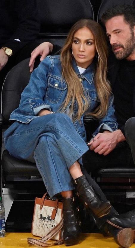 Who Made Jennifer Lopezs Blue Jeans Denim Jacket And Black Boots