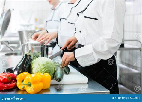 Chefs Preparing Meals In Commercial Kitchen Stock Image Image Of