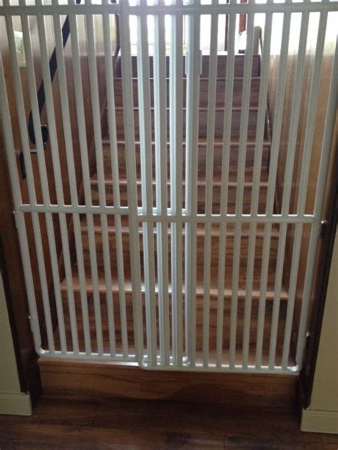 Carlson design studio metal walkthru gate with pet door. tall cat gates | Cat gate, Cats, Gate