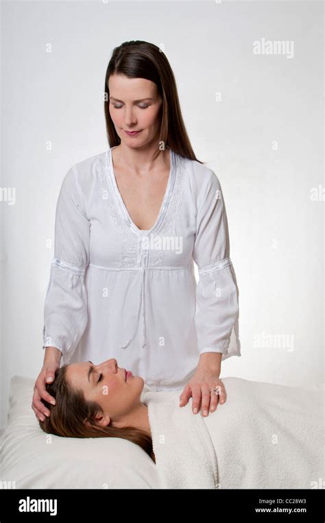 Vertical Woman Receiving Massage Reiki Hi Res Stock Photography And