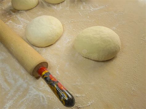 Dough And Flour On A Wooden Board A Rolling Pin And A Towel Stock