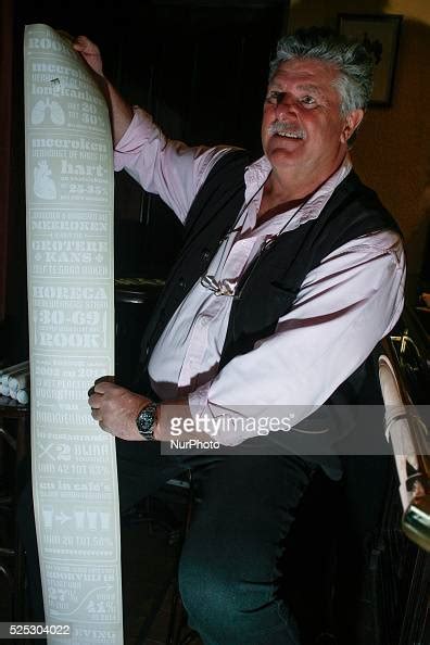 proprietor of the oldest pub in the hague bart van dam shows a paper news photo getty images