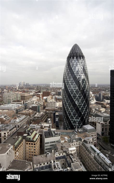 High Level Semi Aerial View Down Of The Gherkin To Canary Wharf On A