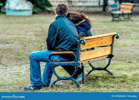 Young Couple In Love Sitting On The Bench Back Side View Editorial Photography Image Of Park