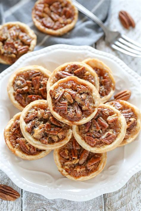 Small Pecan Pies On A White Plate