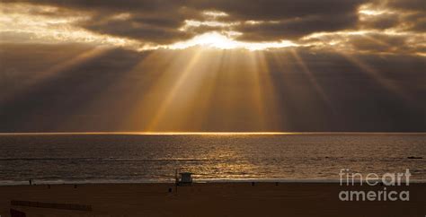 Calm Clouds With Magnificent Sun Rays Over Ocean Photograph By Jerry Cowart