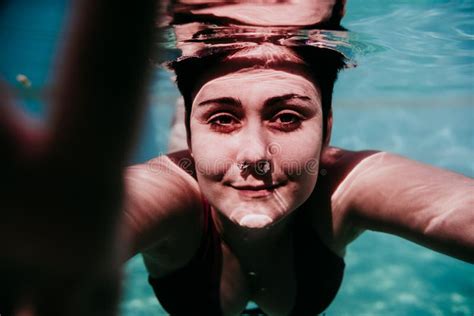 Portrait Of Young Woman Diving Underwater In A Pool Summer And Fun