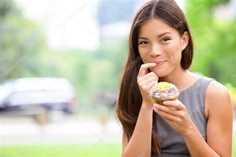 Cupcake Woman Eating Cupcakes In New York Stock Photo By Maridav