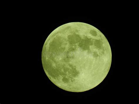 Glowing Green Full Moon Illuminated Against A Dark Background Stock