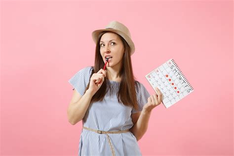 Premium Photo Portrait Pensive Woman In Blue Dress Hat Holding Red