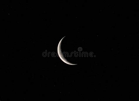 Crescent Phase Of The Moon Against A Dark Sky Stock Photo Image Of