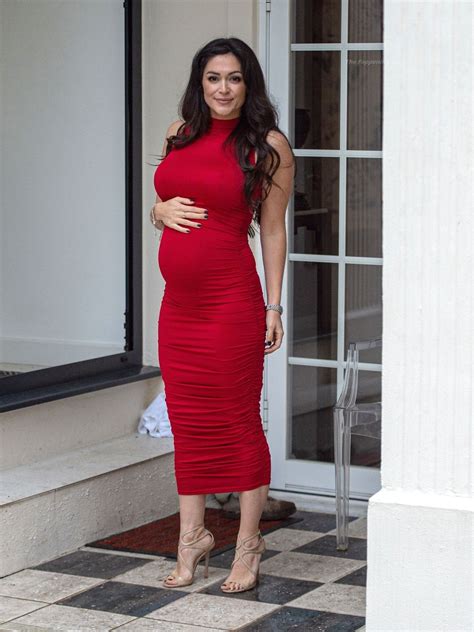 Casey Batchelor Shows Off Her Baby Bump In A Red Dress Photos