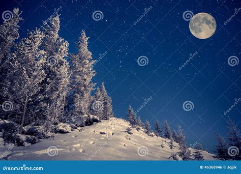 Full Moon In The Night Sky In Winter Mountains Stock Photo Image Of