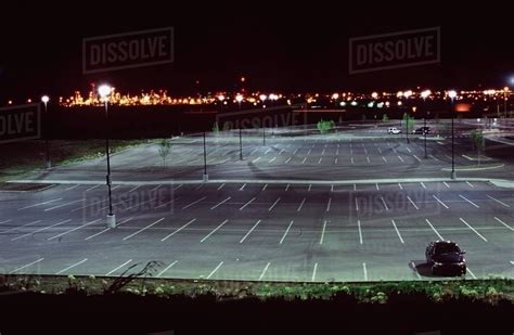 An Almost Empty Parking Lot Illuminated At Night Stock Photo Dissolve