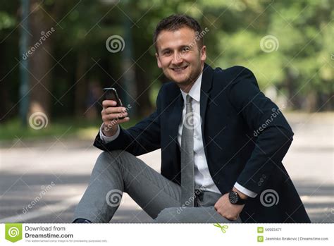 Young Businessman On The Phone Outdoors In Park Stock Image Image Of