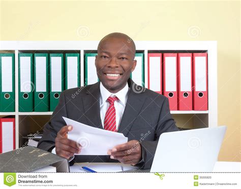 Our entire vocabulary is spoken by native speakers. Laughing African Businessman Reading A Letter Stock Photo ...