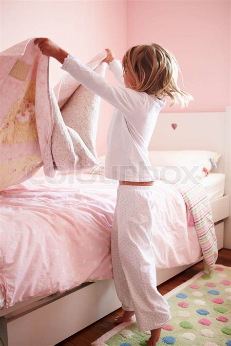 Young Girl Making Her Bed Stock Image Colourbox