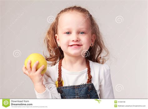 Pretty Little Girl Holding Apple In Studio Stock Photo Image Of
