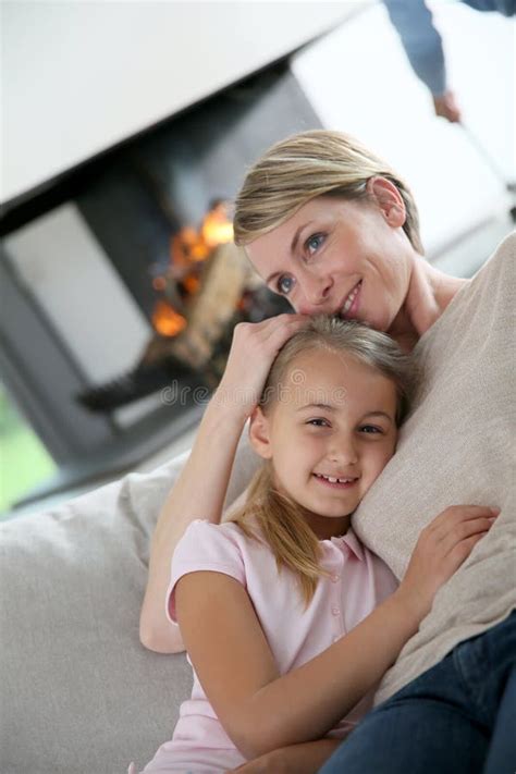 Portrait Of Mother Holding Her Daughter In The Arms Stock Photo Image