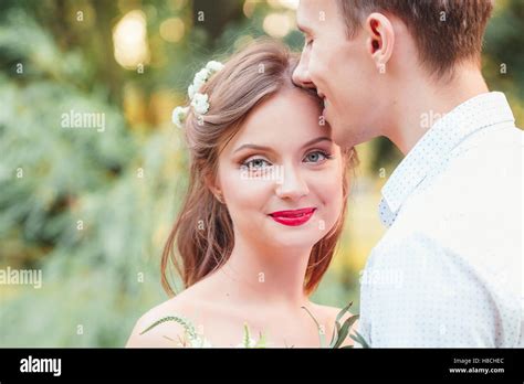 Happy Young Newlywed Couple Man Buried His Nose In Her Hair In Park