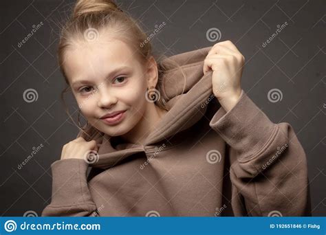 Hild Girl With Long Hair Gathered In A Bun Stock Photo Image Of
