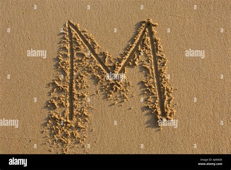 Alphabet Hand Writen Letters On The Sand Stock Photo Alamy
