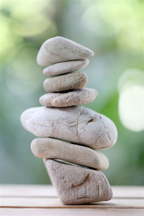 Balance Rock Or Zen Stones On Wooden Floor And Have Nature Green Stock