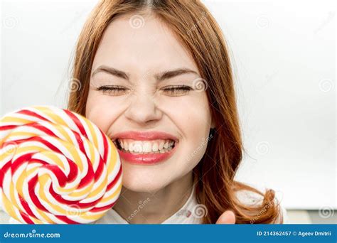 Cheerful Pretty Woman With Big Multicolored Lollipop Smile Sweets