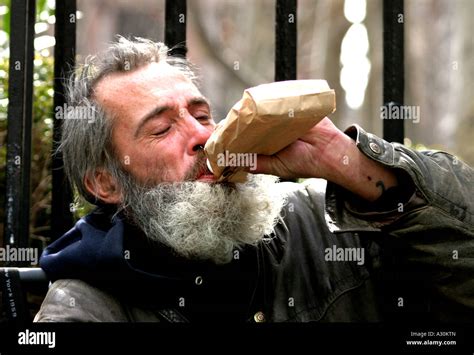 Homeless Man Having A Drink Stock Photo Alamy